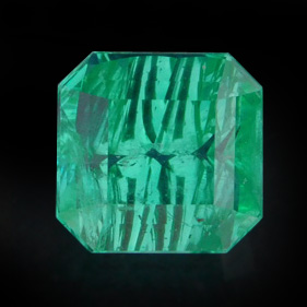 Emerald with concave facets