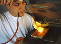 Soldering the granules onto the jewel. Samuel Wiedmer at work.